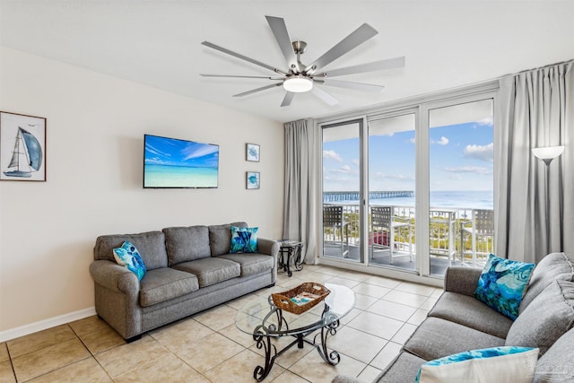 tiled living room with ceiling fan