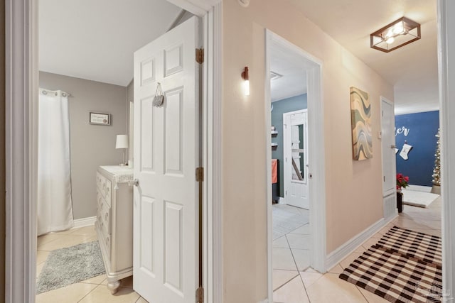 hallway featuring light tile patterned floors