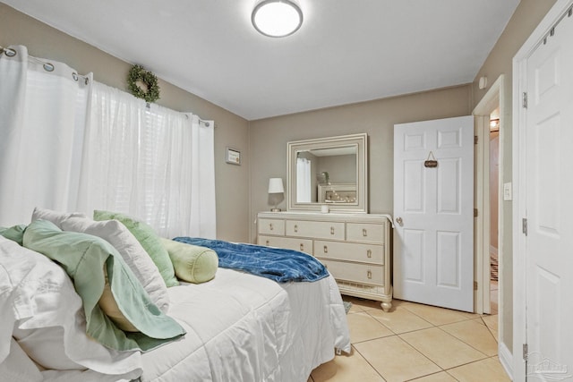 bedroom featuring light tile patterned floors