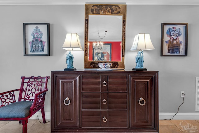 interior details with baseboards and ornamental molding