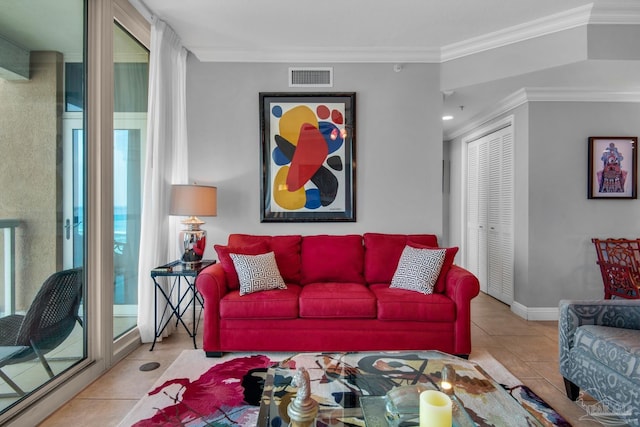 tiled living room featuring visible vents and crown molding
