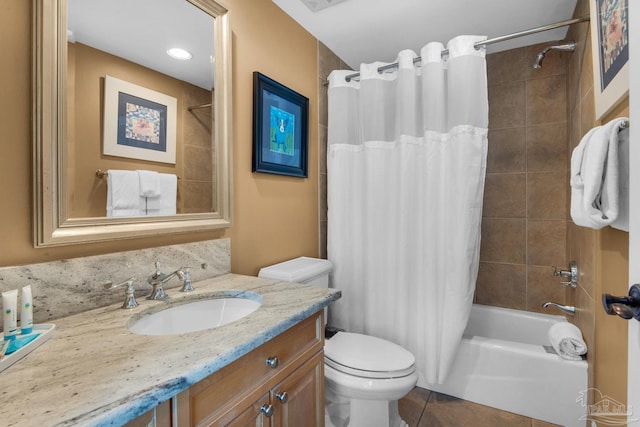 bathroom with tile patterned flooring, visible vents, toilet, vanity, and shower / bath combo with shower curtain