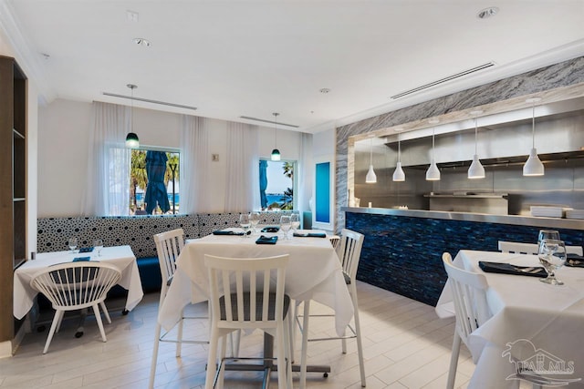 dining room with wood finished floors and visible vents