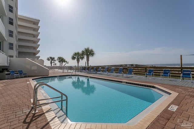 view of swimming pool with a patio