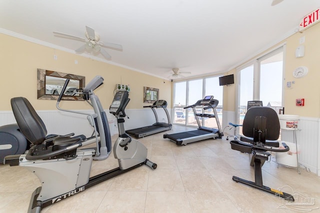 gym featuring ornamental molding, light tile patterned floors, and ceiling fan