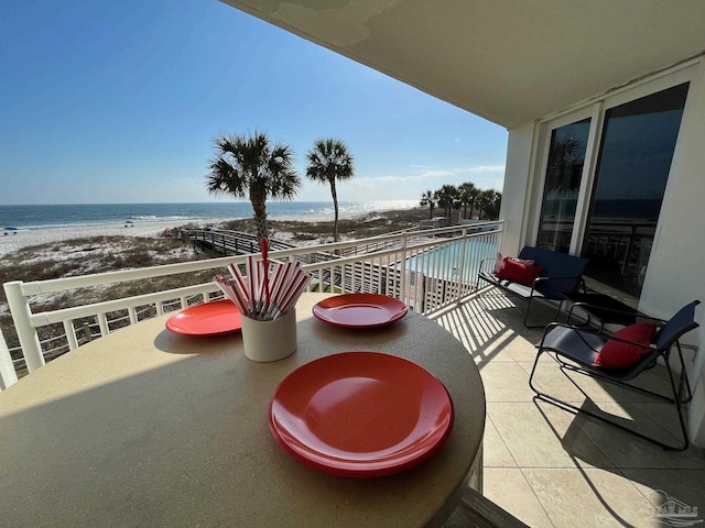 balcony with a view of the beach and a water view