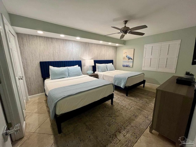 bedroom with light tile patterned floors and ceiling fan