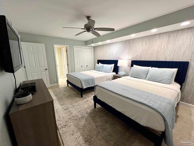 bedroom featuring ceiling fan and a closet