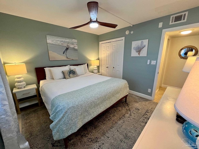 bedroom featuring ceiling fan and a closet