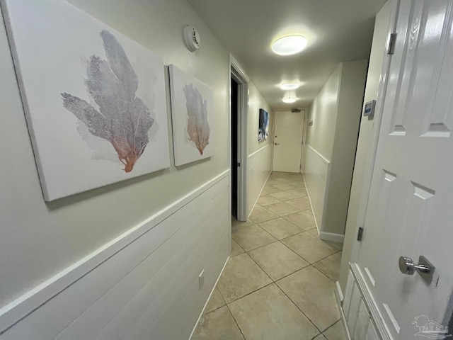 hallway featuring light tile patterned floors