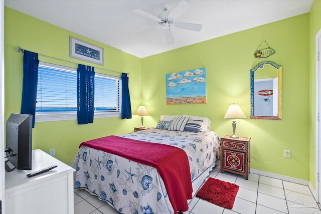 bedroom with ceiling fan and light tile patterned floors