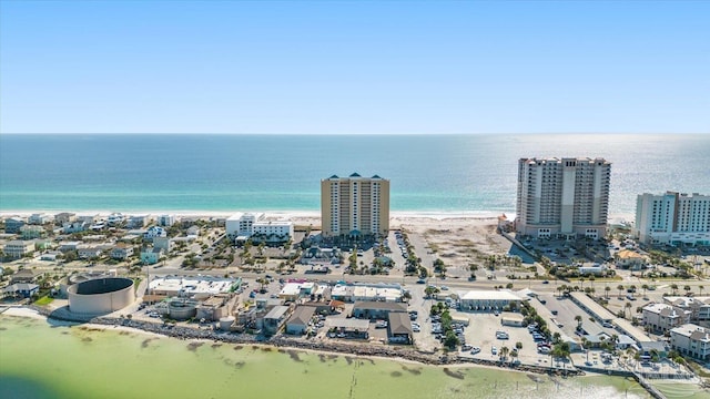 drone / aerial view featuring a water view and a view of the beach