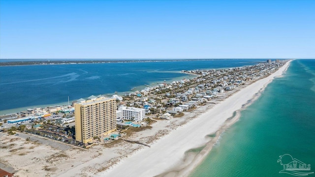 aerial view with a water view and a beach view