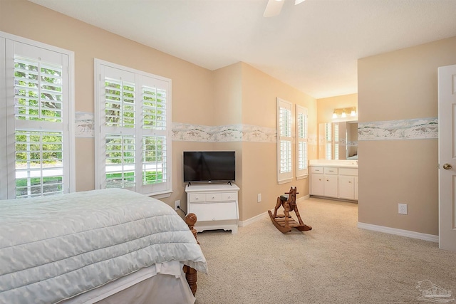 4200 Madura Rd, Gulf Breeze, FL 32563 - bedroom with light colored carpet, ceiling fan, ensuite bathroom, and baseboards