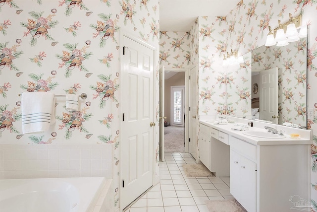 4200 Madura Rd, Gulf Breeze, FL 32563 - bathroom with a sink, double vanity, wallpapered walls, tile patterned floors, and a garden tub