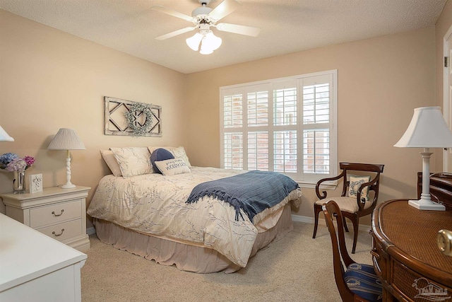 4200 Madura Rd, Gulf Breeze, FL 32563 - bedroom with baseboards, light carpet, and ceiling fan