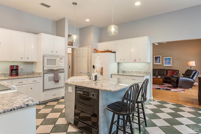 4200 Madura Rd, Gulf Breeze, FL 32563 - kitchen featuring white appliances, light floors, a sink, white cabinetry, and visible vents