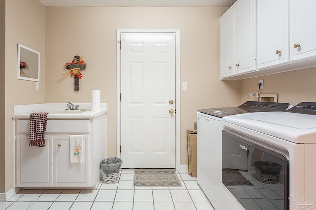 4200 Madura Rd, Gulf Breeze, FL 32563 - washroom with light tile patterned floors, independent washer and dryer, a sink, baseboards, and cabinet space