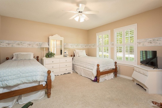 4200 Madura Rd, Gulf Breeze, FL 32563 - bedroom featuring baseboards, a ceiling fan, and light colored carpet