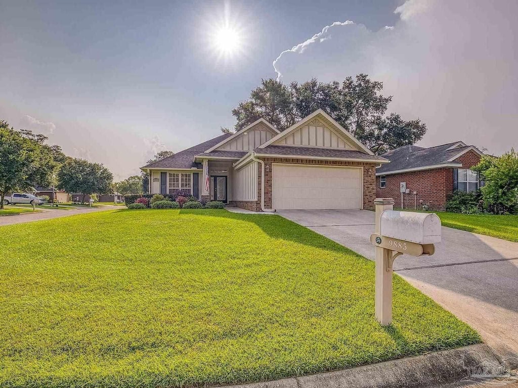 view of front facade with a garage and a front yard