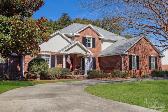 view of property with a front lawn