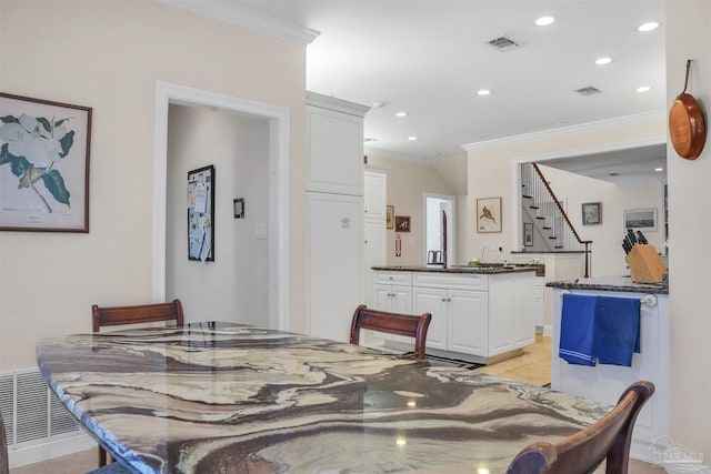 dining room featuring ornamental molding