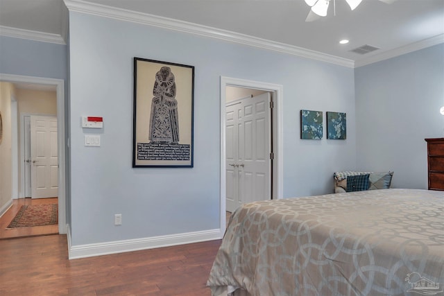 bedroom featuring crown molding, ceiling fan, and dark wood-type flooring