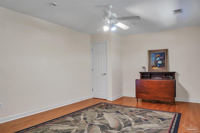 bedroom with light hardwood / wood-style floors and ceiling fan