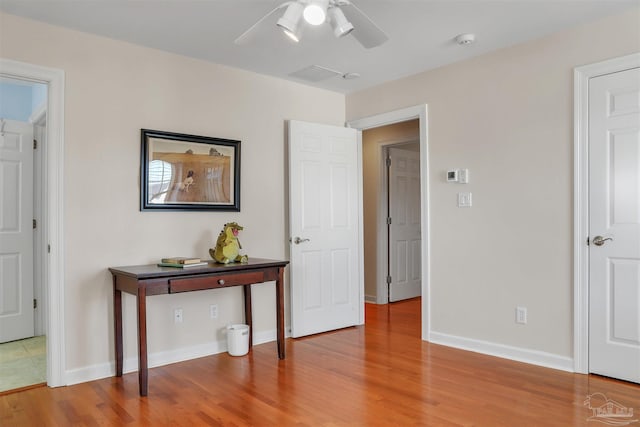 bedroom featuring hardwood / wood-style flooring and ceiling fan