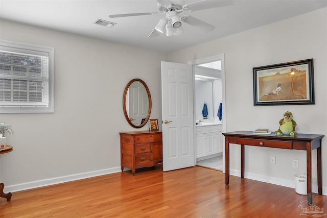 interior space with wood-type flooring and ceiling fan