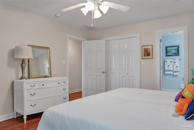 bedroom featuring a closet, dark hardwood / wood-style floors, and ceiling fan