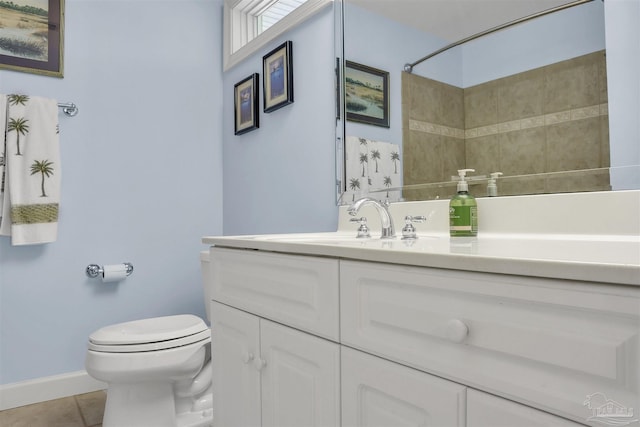 bathroom with vanity, a shower, tile patterned floors, and toilet