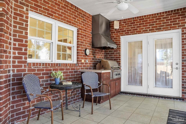 view of patio featuring ceiling fan, area for grilling, and french doors