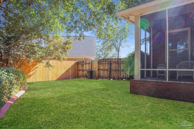 view of yard with a sunroom