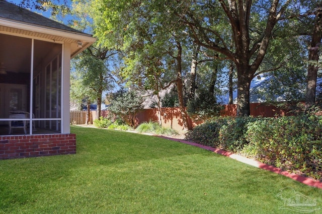 view of yard with a sunroom