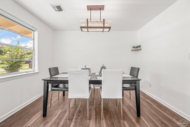 dining area with wood-type flooring