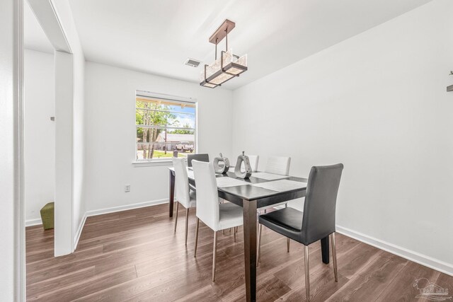 dining room featuring dark hardwood / wood-style flooring