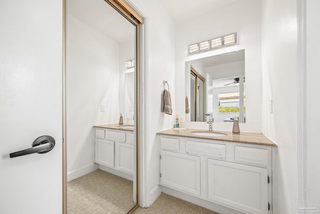 bathroom with tile patterned floors, ceiling fan, and vanity