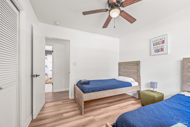 bedroom with light wood-type flooring and ceiling fan