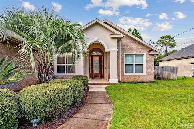 view of front of home with a front lawn