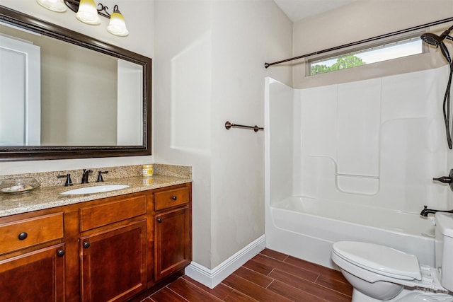 full bathroom featuring wood-type flooring,  shower combination, vanity, and toilet