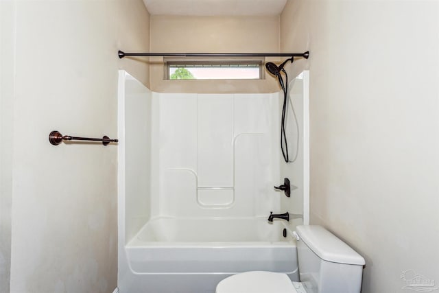 bathroom featuring toilet and shower / bath combination