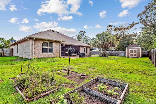 view of yard with a storage shed and a sunroom