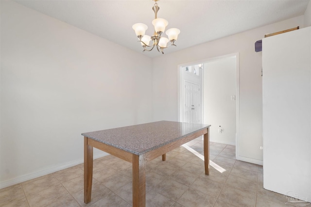 unfurnished dining area featuring light tile patterned floors and an inviting chandelier