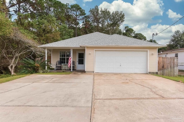 view of front of property featuring a garage and covered porch