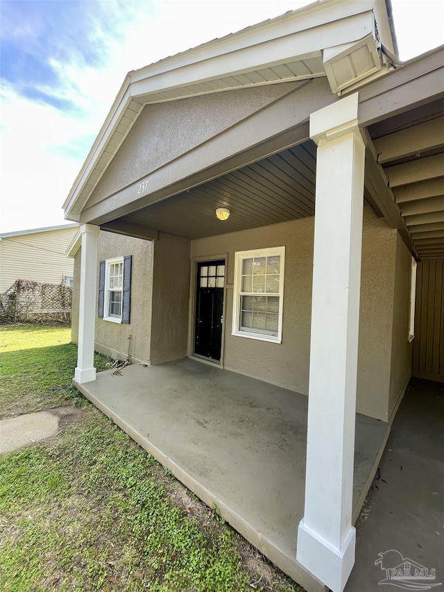 doorway to property with a patio area