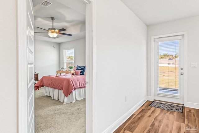 bedroom with wood-type flooring and ceiling fan