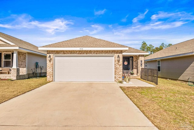 view of front of house with a garage and a front lawn