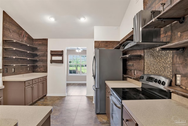 kitchen featuring appliances with stainless steel finishes, ceiling fan, tasteful backsplash, and tile patterned flooring