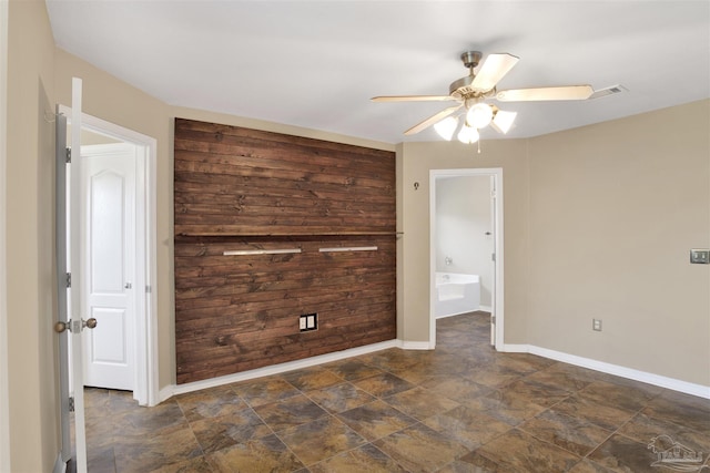 unfurnished room featuring ceiling fan